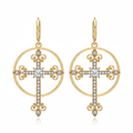 Gold cross hoop earrings on white background